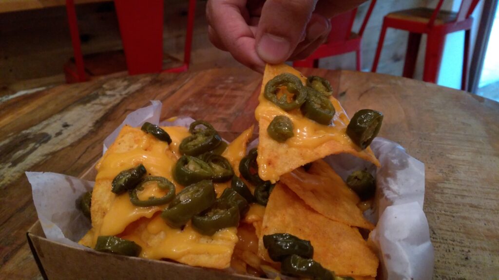 Cheesy nachos with herb fried jalapenos - Burger Bros